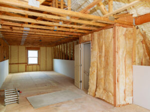 A room with open beams and insulation