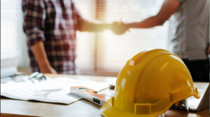 A contractor shakes hands with a homeowner